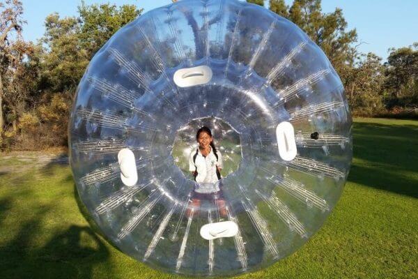 Girl Playing in Inflatable Zorb Ball